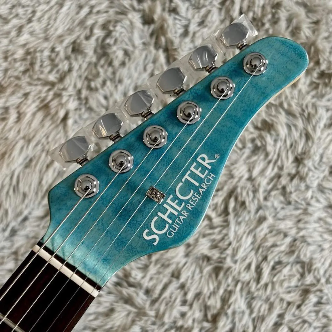 Schecter L-SD-DX-24-VTR/R · Aqua Blue · 实物琴头正面