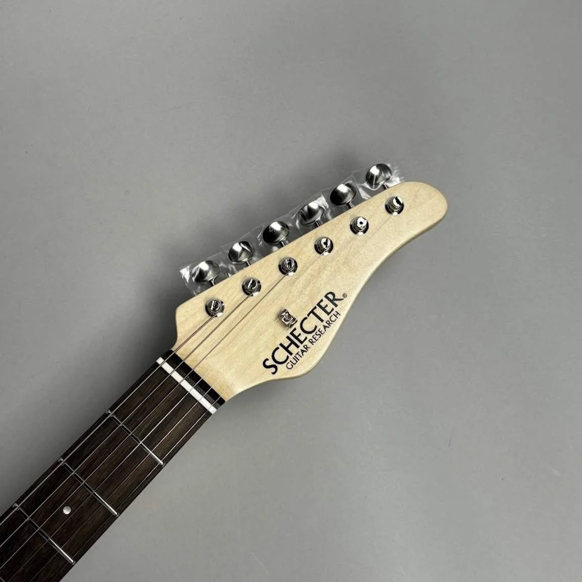 Schecter L-S-PT-AS/R · See-Through Blue · 实物琴头正面