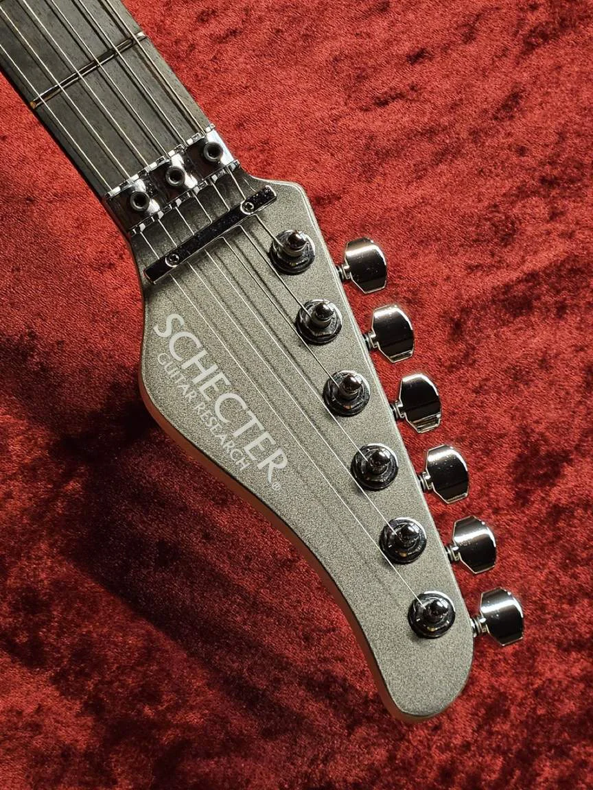 Schecter AR-06 FR-KC · Gunmetal Black · Actual instrument, headstock front