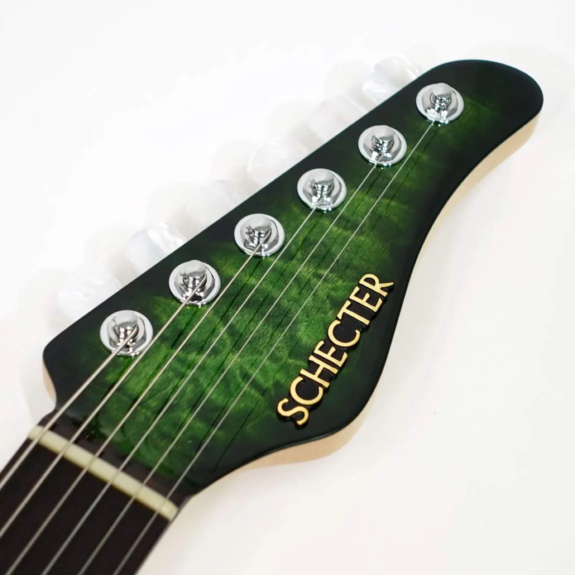 Schecter EX-5B-24-CTM-VTR · Emerald Green Burst · Actual instrument, headstock front