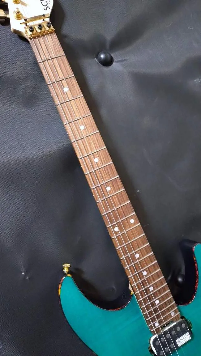 Schecter NV-4-24-AL-FM/OGR/R · See-Through Orange · Actual instrument detail 4