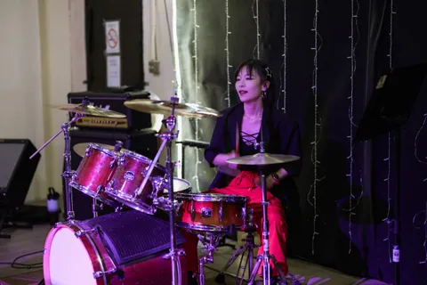 Adult student drummer performing on stage